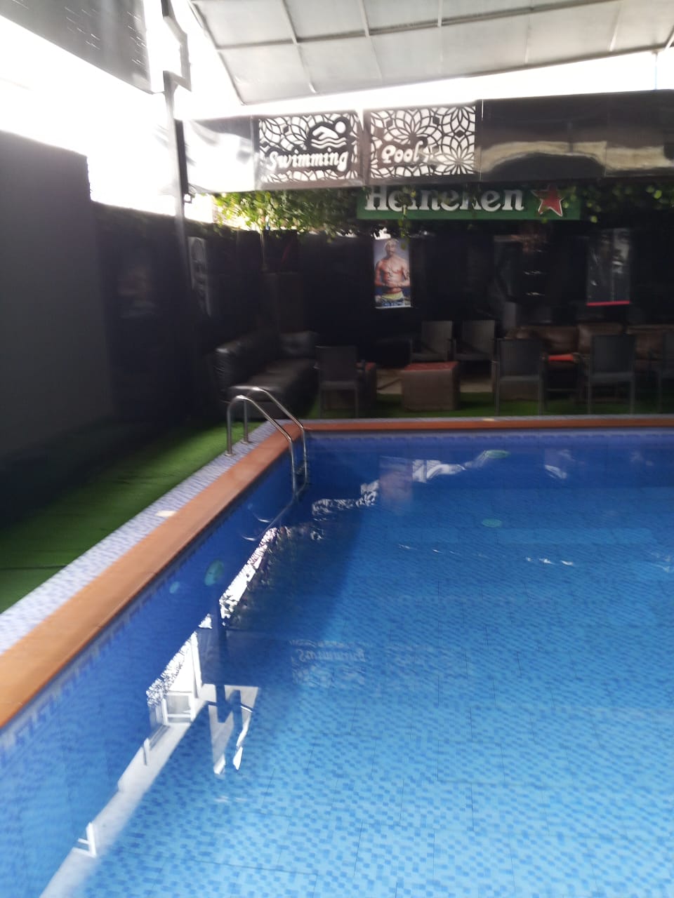 Outdoor swimming pool and poolside lounge at Craycaston